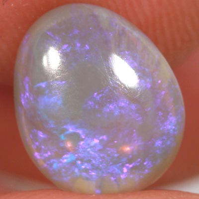SOLID CRYSTAL OPAL Sparkles of purple over a mauve hue